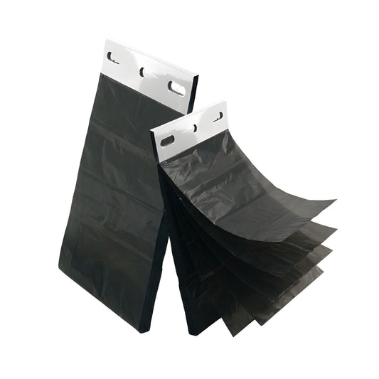 Black header waste bags fanned out, each with a white punched header strip.
